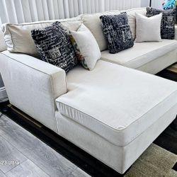 Excellent condition!! Beige 2-piece fabric sectional, very clean, removable covers for washing, delivery available!