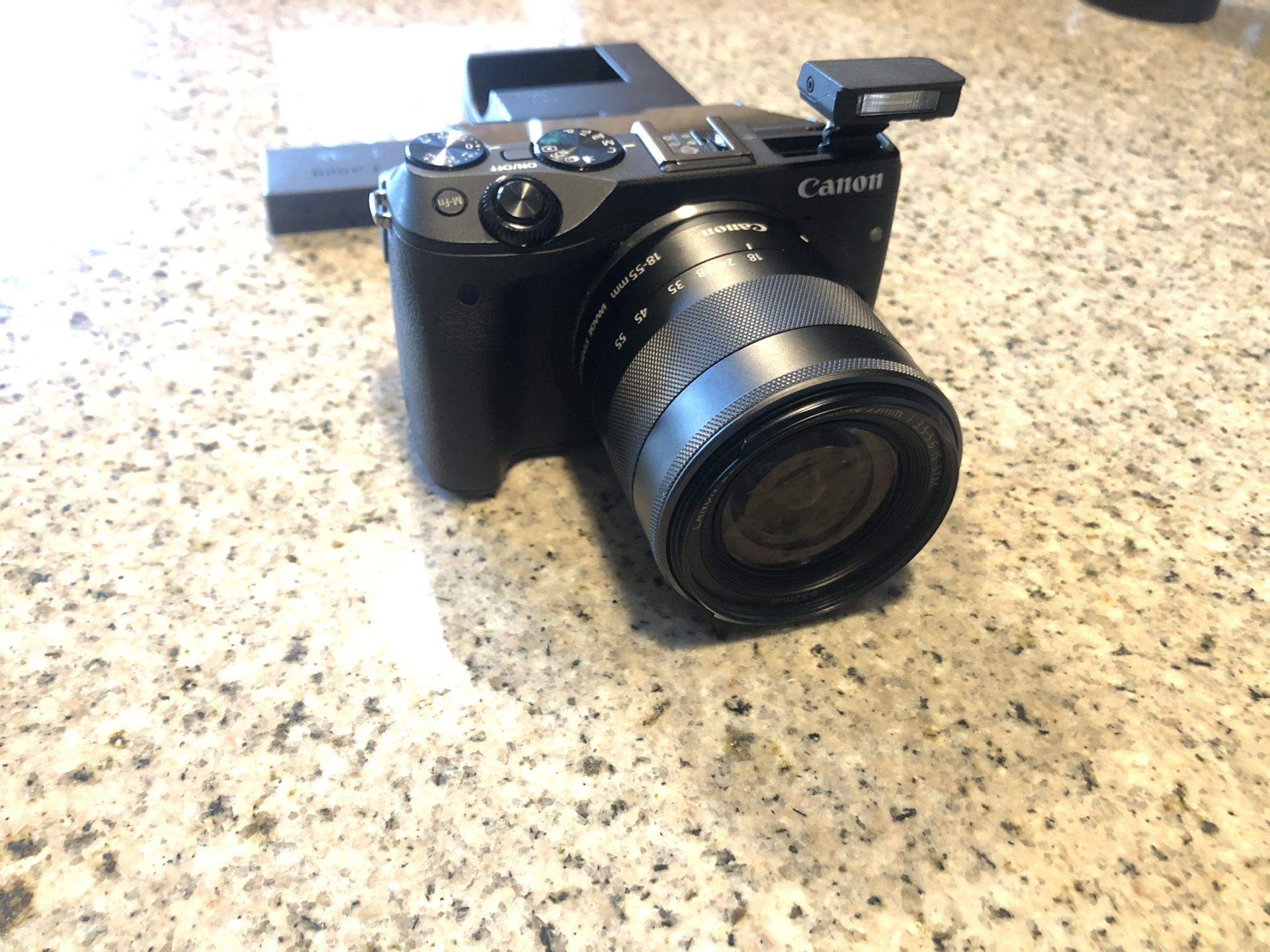 Canon M3 with lens battery and charger