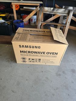 Brand new never used samsung range hood microwave