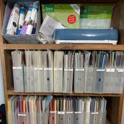 Cricut Explore Air 2 , 5 Cutting Mats, & 23 bins Of Papers