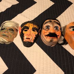 Vintage Halloween mask decor, including Wolfman