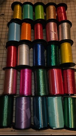 25 large rolls of Curling ribbon