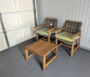 Outdoor patio wood chairs with coffee table and cushions