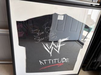 framed vintage WWF Attitude T-shirt featuring the iconic scratch logo and a signature by Stone Cold Steve Austin,