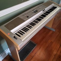 88 Keys Yamaha DGX 505 Grand Digital Piano  with Bench , Music Stand, And Sustained pedal and power cord.  Great Keyboard to Learn on.  It Plays music