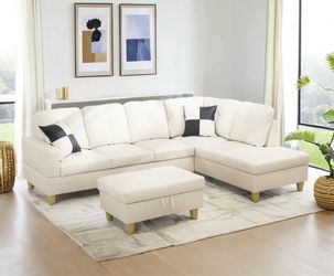 White leather sectional couch and ottoman