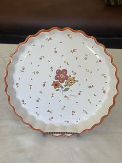 Calico Village by David Davir scalloped baking dish with floral pattern.