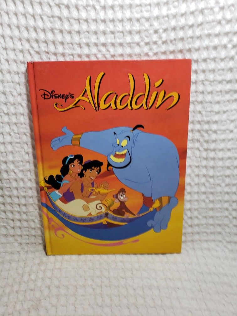 Disney's Aladdin by Penguin Books (1992). Very good condition.  Hardback book 96 pages . Measures 11 1/2" X 8 1/2" . Smoke free home. 