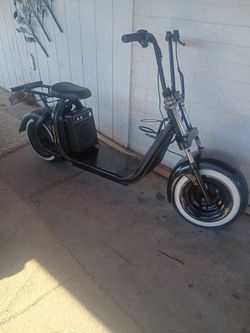 Electric Harley scooter runs good with charger and has loud Bluetooth speaker 400$