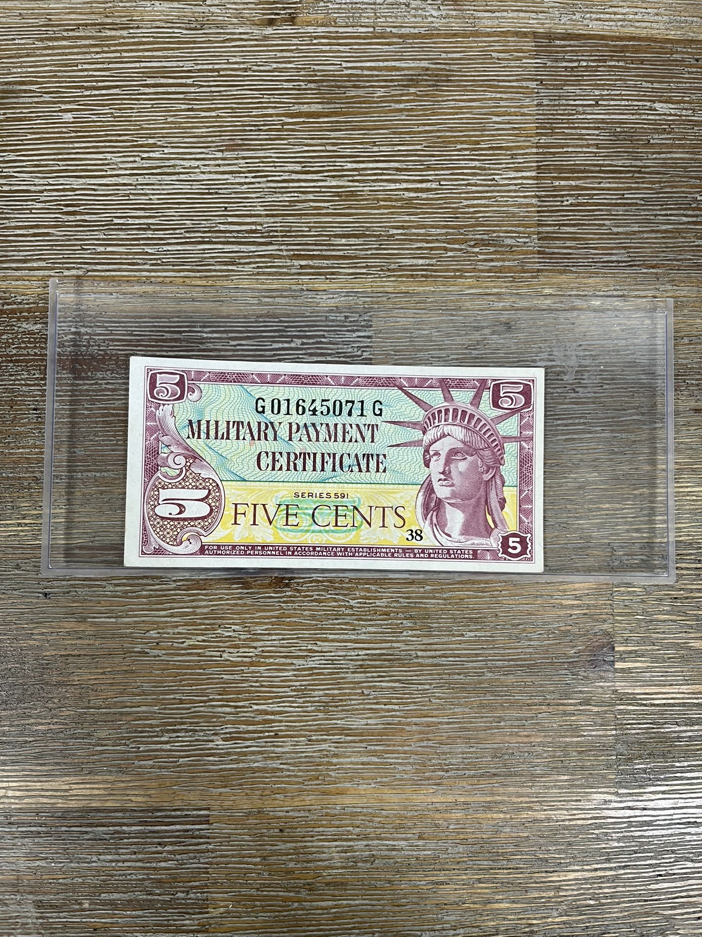 Military Payment Certificate (MPC), specifically a five-cent note from the Series 541.