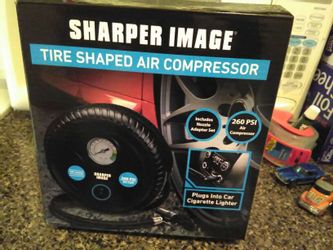 Brand new tire compressor plugs in cigarette lighter