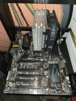 Asrock Z77 extreme6 (damaged AS-IS, was installed incorrectly with standoffs shorting a RAM stick and PCIE lane.  I've gotten it to POST randomly a fe