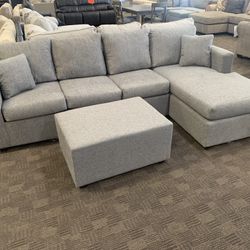 New Grey Sectional And Ottoman 