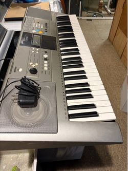 Yamaha electric keyboard with a power cord to power it and stand Yamaha electric keyboard with a power cord to power and stand