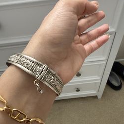 Description: Vintage silver bracelet with detailed engraved design. Weight: 14.53 grams (see photo with scale).  Good condition and fully wearable. Un