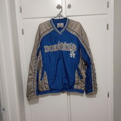 This item is a vintage Los Angeles Dodgers windbreaker jacket from the G-III Sports by Carl Banks line