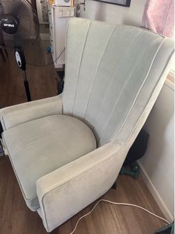 Beautiful light green and neutral color high back chair.