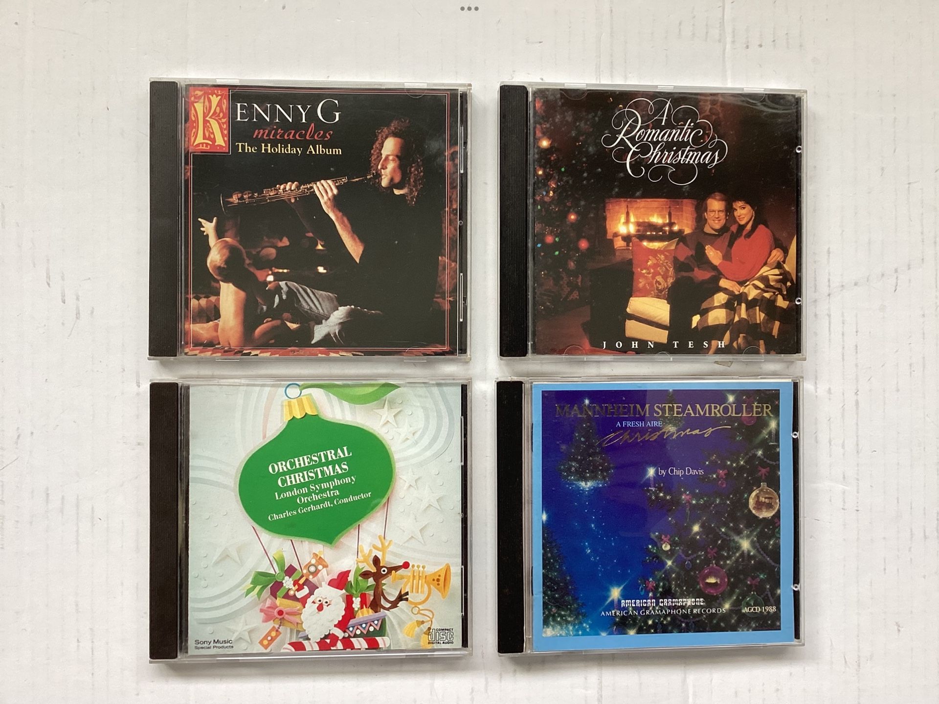 4 Preowned Christmas Music CDs Kenny G., John Tesh, Mannheim Steamroller, London Symphony 