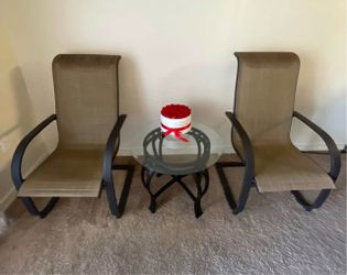 iron armchairs and a coffee table
