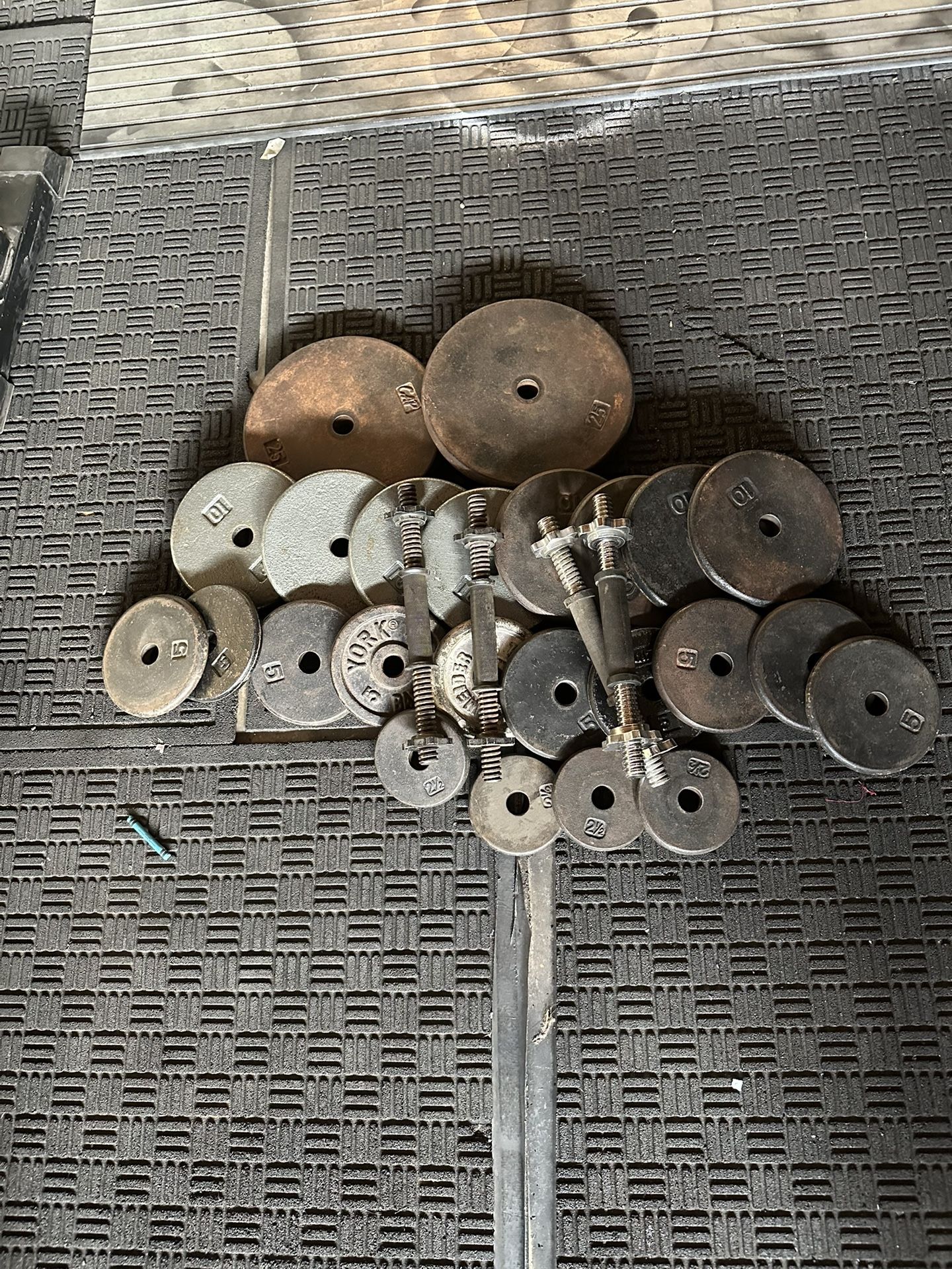 Standard weights 190lbs total plus two adjustable dumbbells handles