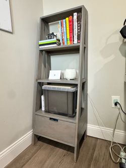 Grey bookshelf with drawer