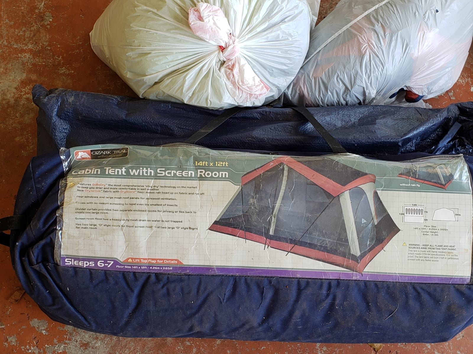 Ozark Trail - out door equipment- Large camping tent w screen and patio. Size 14ft by 12ft