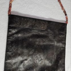 Cole Haan 1928 black tooled leather handbag 