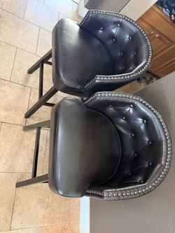 4 brown swivel bar stools