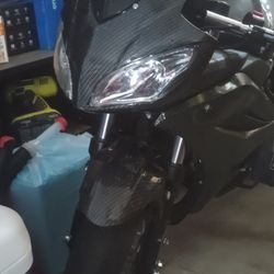 i have a 50mph carbin fiber pocket bike im tradeing for electric bike or or electric scooter or 1000 dollars cash