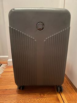 Used Delsey medium luggage