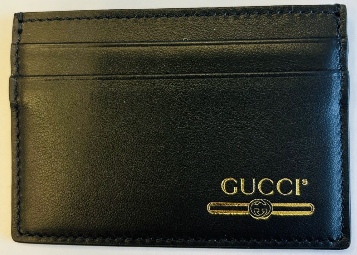 Gucci black and gold card holder