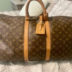 Louis Vuitton Monogram
Bandouliere 55