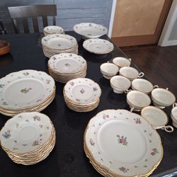 Vintage Hutschenreuther Bavaria porcelain dinnerware set, includes plates, cups, and bowls