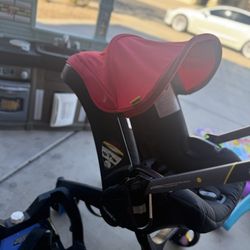 red Doona Car seat