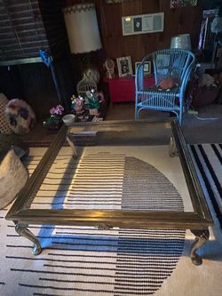 Excellent condition glass and brass coffee table