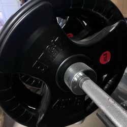 Rubber Olympic weight plates and Olympic barbell available.