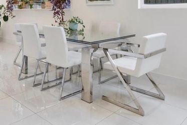 Modern glass dining room table with 6 white leather chairs