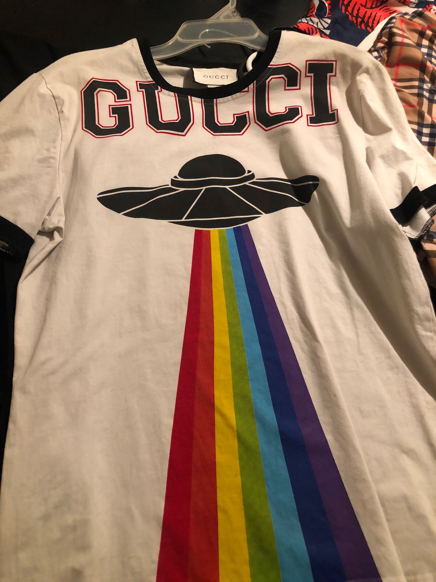 4 Gucci shirts one Gucci sweater and one Burberry shirt all for the let go