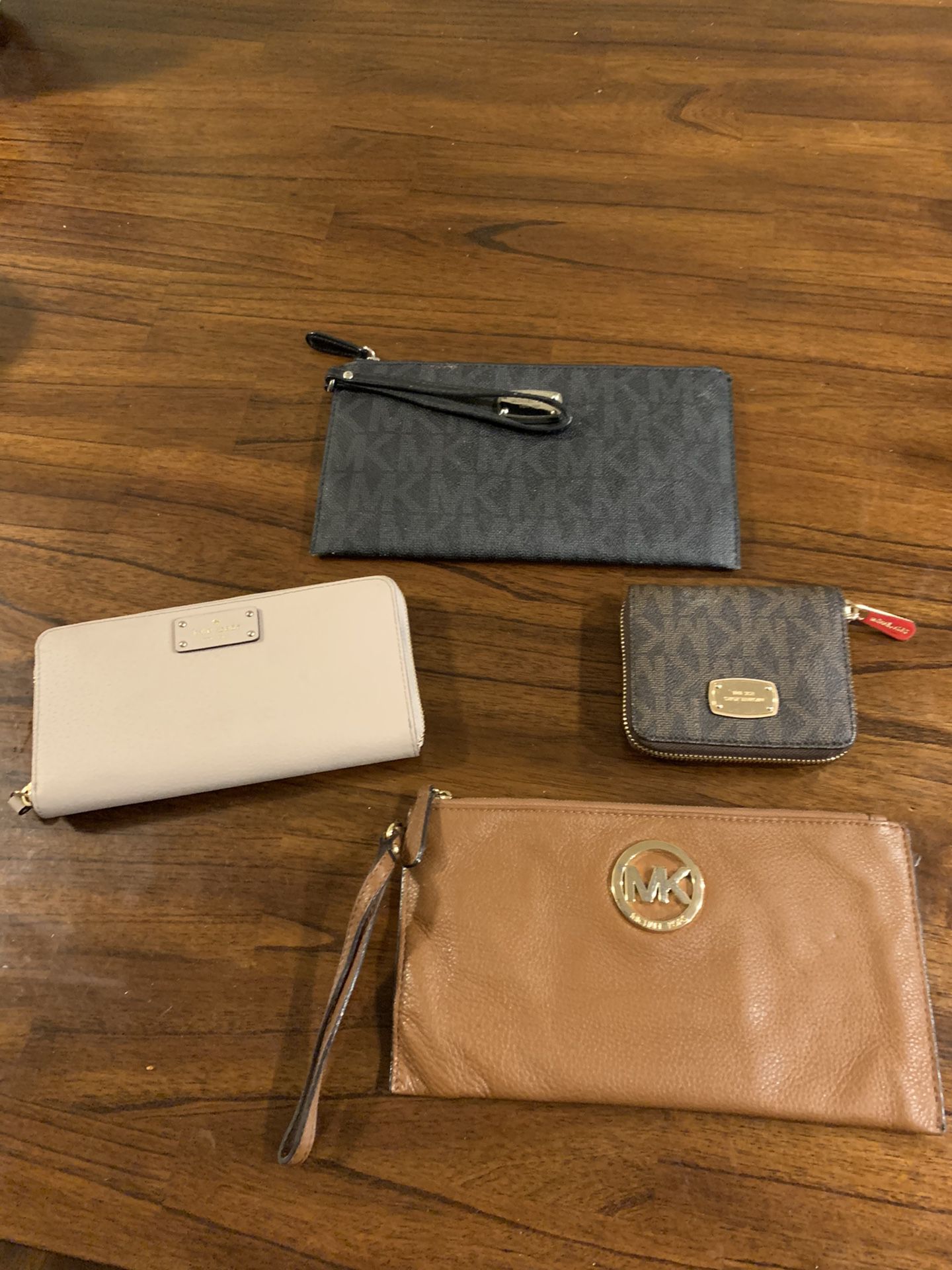 Michael Kors and Kate Spade wallets and wristlets