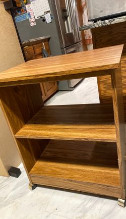 Wood shelf whit wheels 31 inches tall x 25 wide x 19 deep