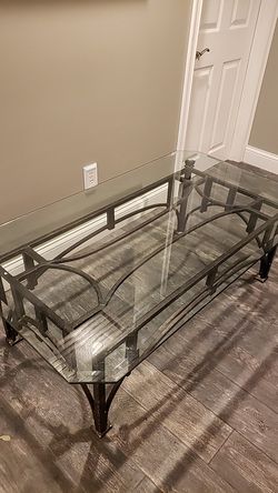 52 in by 30 in wrought iron glass coffee table