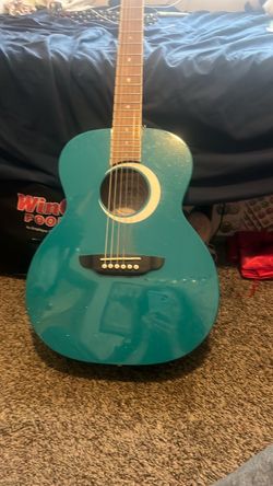 Teal sparkling acoustic guitar