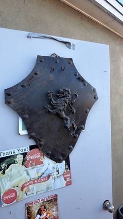 Vintage metal shield with lion and hooks