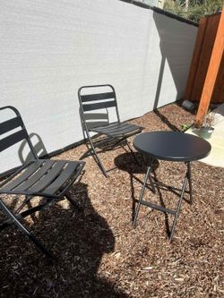 two chairs and a metal table