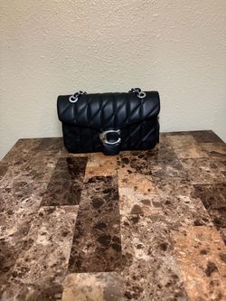 Black quilted tabby bag
