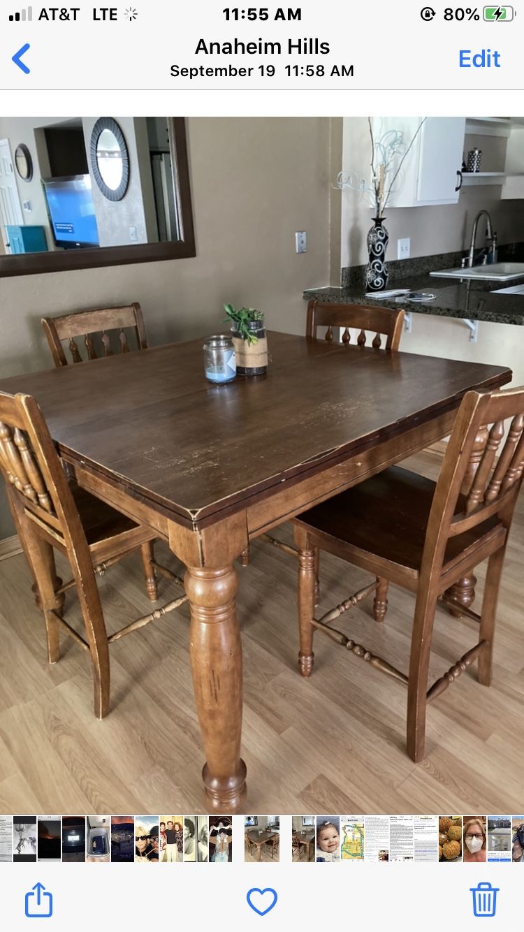 Dining table with four chairs. Also extends out to large rectangle