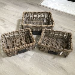 Set of three wooden baskets