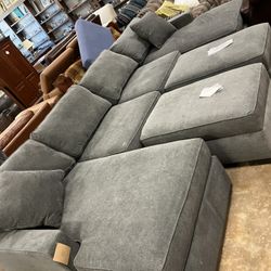 Grey Sectional With 2 Open Top Ottomans