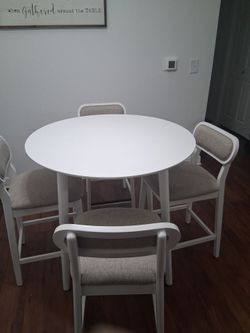 All white and round table only a month old