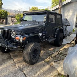 Black 1997 Jeep Wrangler 112,000.miles 